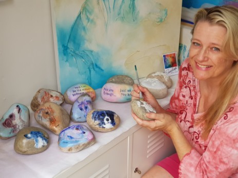 Sunday L Artist with her 12 painted stones to giveaway 2018